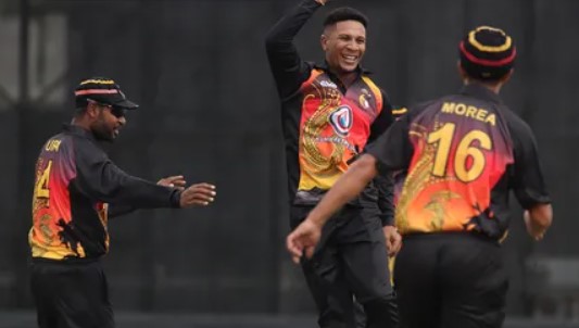 Papua New Guinea cricket team players celebrating their victory.