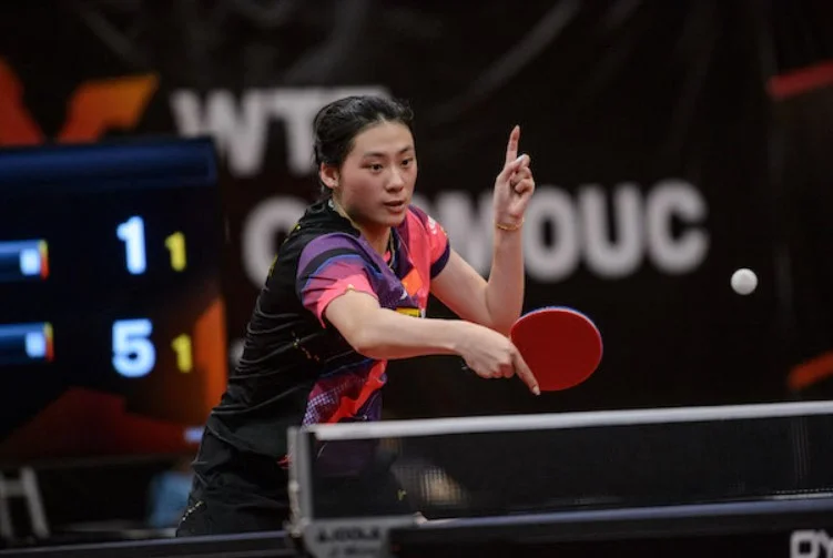 Chen Yi, showcasing her right-hand attack style in play.
