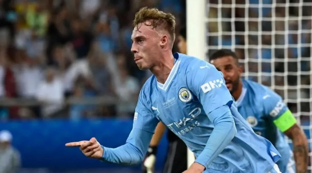 Cole Palmer of Manchester City rejoices after leveling the score against Sevilla in the UEFA Super Cup.