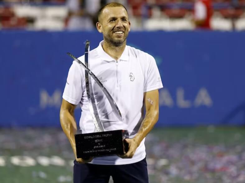 Dan Evans celebrating a victory on the tennis court.