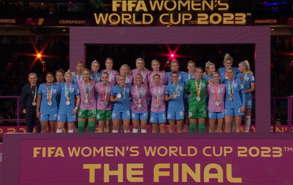 England's female football squad captured during the medal ceremony.