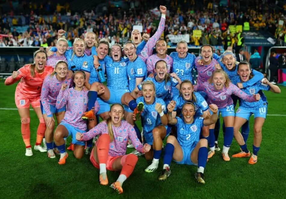 Jubilant English players huddled together, basking in their triumph.