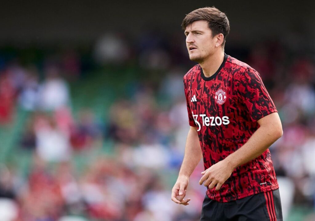 Maguire on the field, focused on the ball during a match.