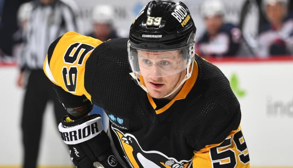 Jake Guentzel in action during a Pittsburgh Penguins' NHL match.