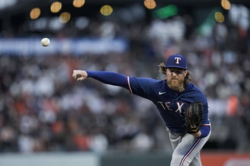 During the first inning of the baseball game on Friday, Jon Gray of the Texas Rangers pitched to a San Francisco Giants batter.