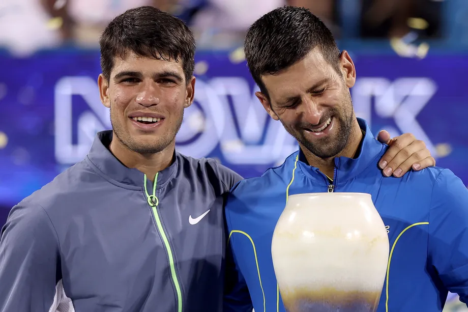 Tennis greats Djokovic and Alcaraz in a friendly moment.