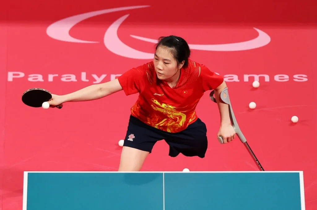 Female athlete from China competing in Paralympic table tennis.