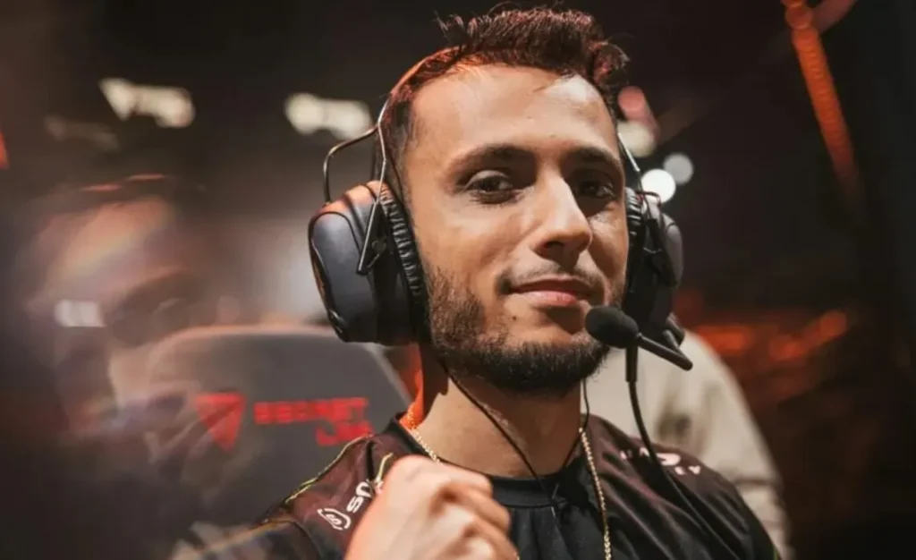 Profile view of FNS, wearing his NRG headset, concentrating on a Valorant match.