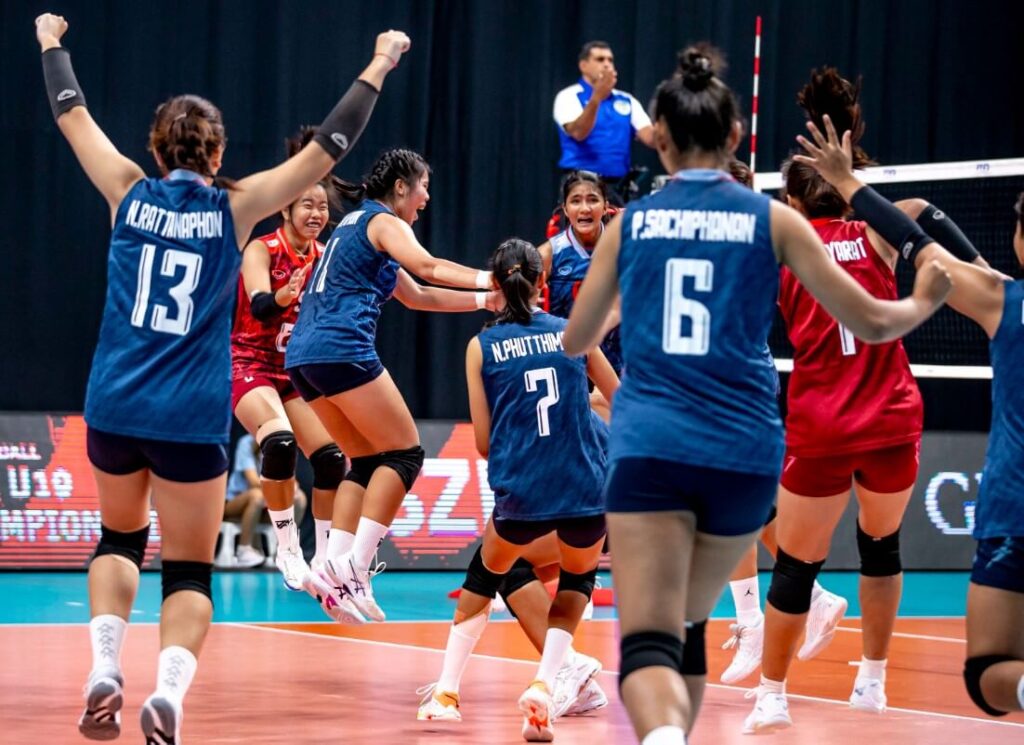 Action shot of Thailand's female volleyball athletes.