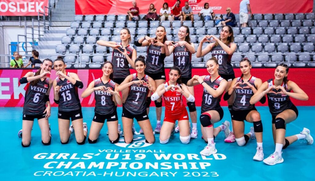 USA women's U19 volleyball team celebrating their victory.