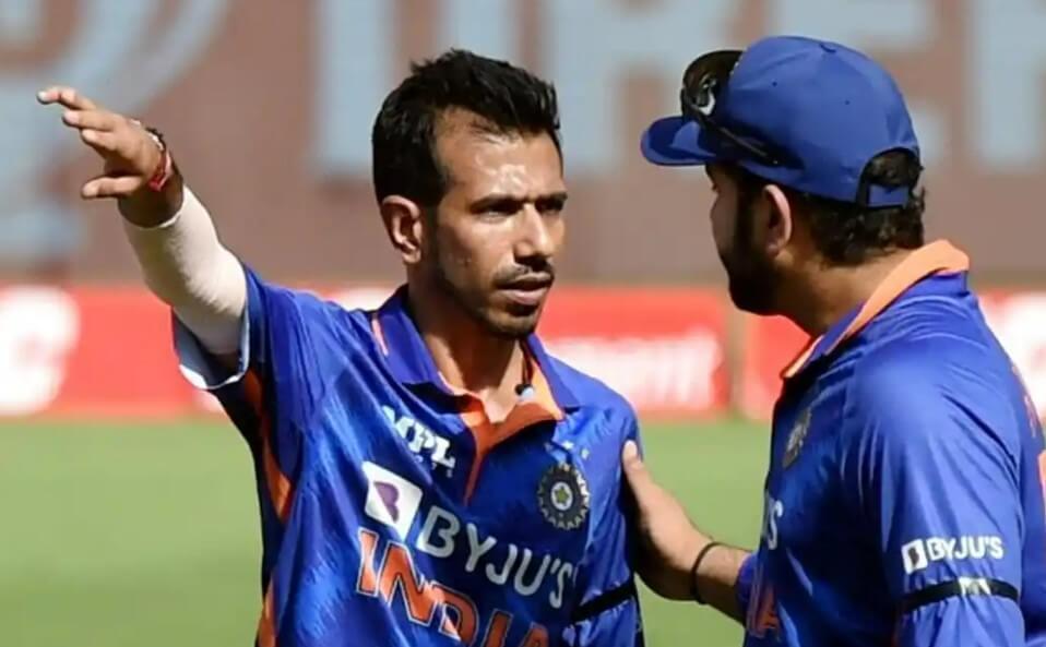 Yuzvendra Chahal and coach in deep discussion, strategizing for the upcoming match.