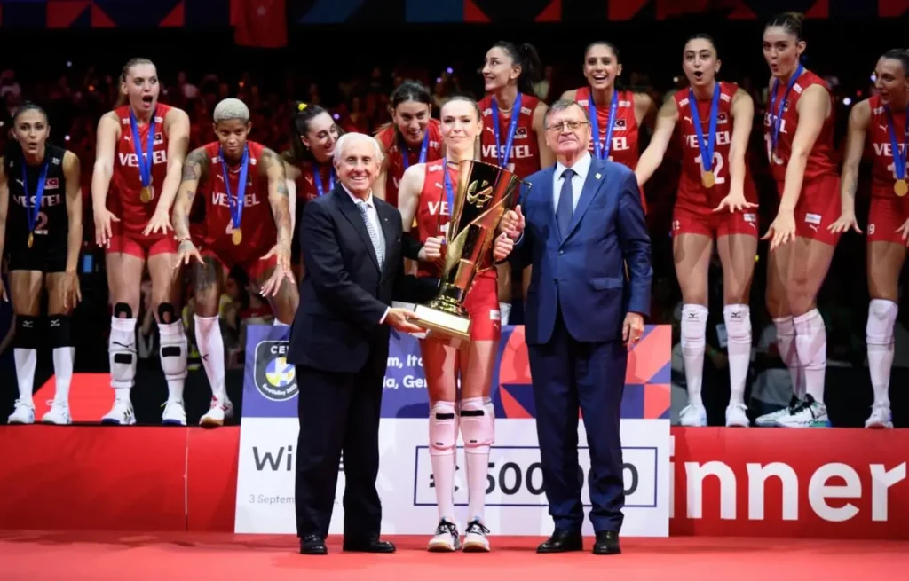 Turkish women's volleyball team celebrating on the EuroVolley podium.