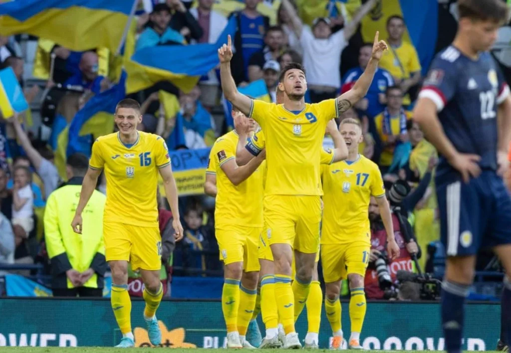 Moment of triumph: Ukraine's football team exulting.