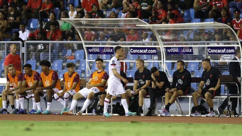 Sergiño Dest leaves the pitch after being shown a red card.