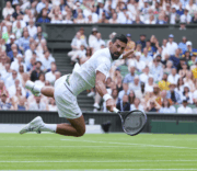 Djokovic wins record Wimbledon quarter final after five set fight